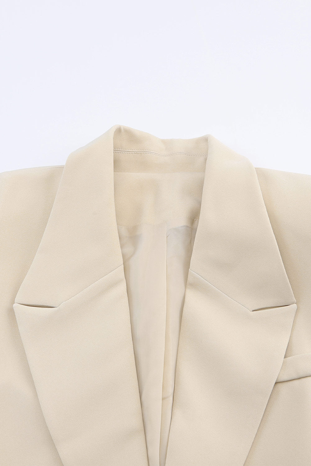 Veste blazer abricot à col à revers, poches et bouton unique