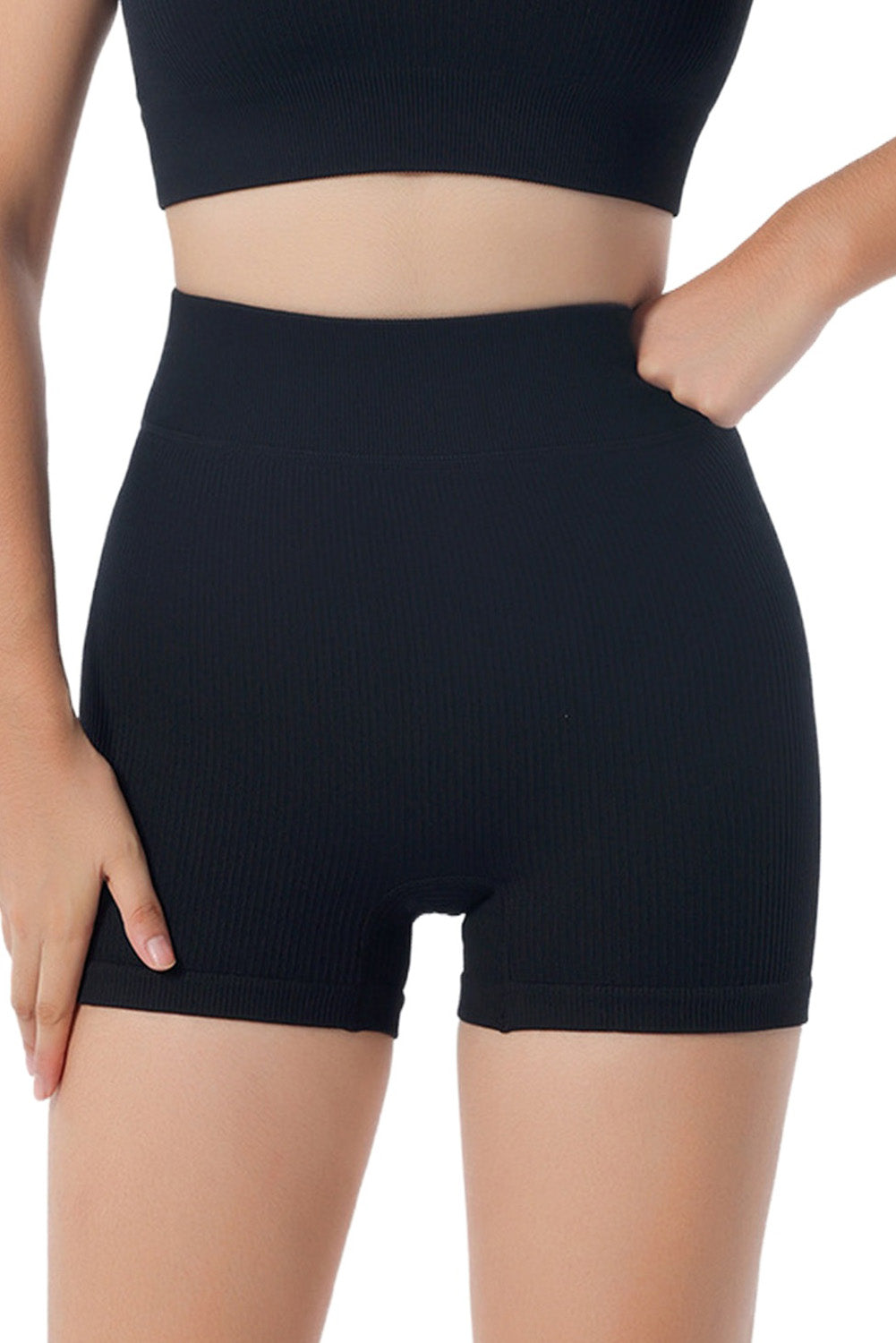 Shorts de yoga noir avec hanches en pêche