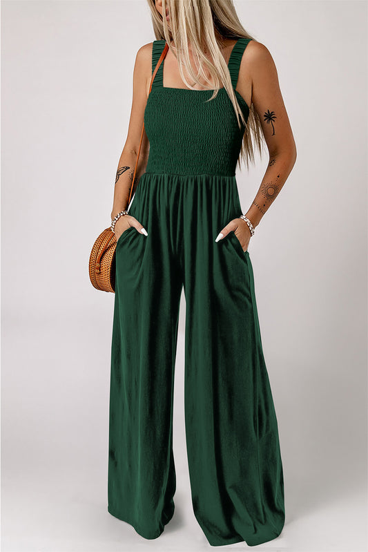 Combinaison large sans manches en vert avec smocks et poches.