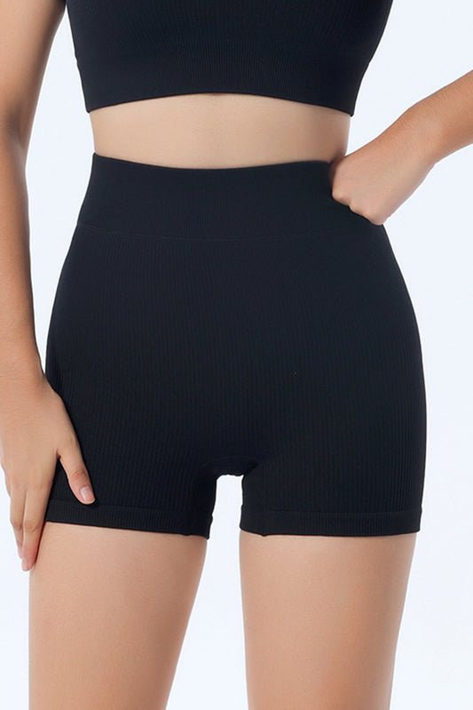 Shorts de yoga noir avec hanches en pêche